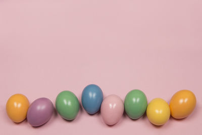 Close-up of multi colored candies against white background