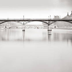 Bridge over river against sky