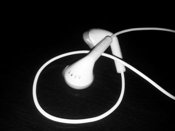 Close-up of electric lamp against black background