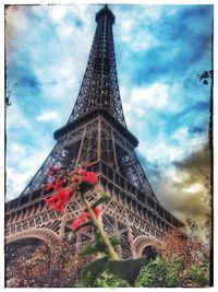 Low angle view of tower against cloudy sky