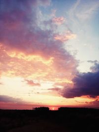 Low angle view of dramatic sky during sunset