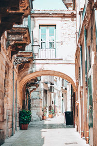 Alley amidst buildings in city