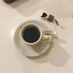 High angle view of coffee cup on table