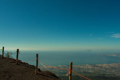 Scenic view of land against clear blue sky