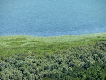 Scenic view of sea against landscape