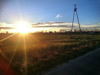 Scenic view of landscape against sky at sunset