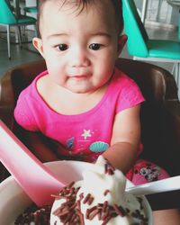 Close-up of cute baby girl at home