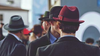 Rear view of men wearing hats