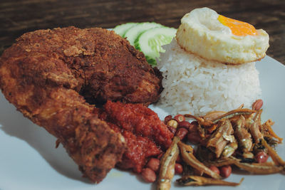 Close-up of meat and vegetables on plate