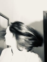 Close-up portrait of a woman at home