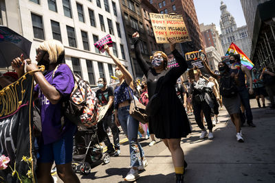 People walking on street in city