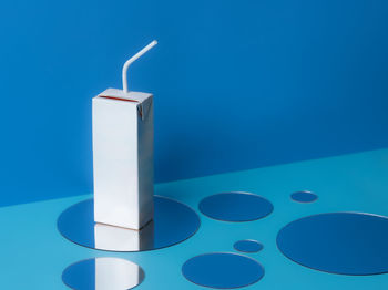 High angle view of usb stick against blue background