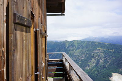 Scenic view of mountains and buildings against sky