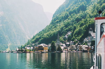 River amidst buildings and mountains