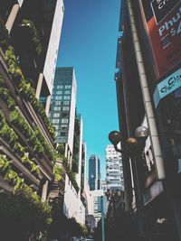 Low angle view of skyscrapers against clear sky