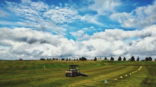 Panoramic view of golf course against sky