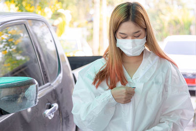 Woman wearing sunglasses while sitting in car