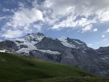 Scenic view of snowcapped mountains against sky