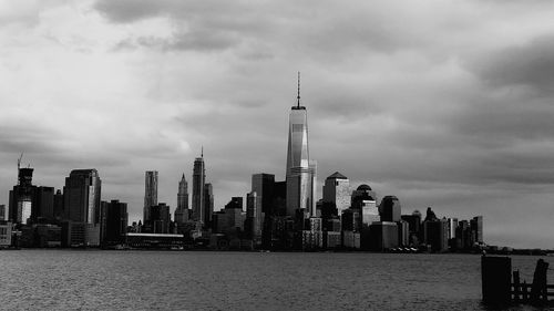 City skyline against cloudy sky