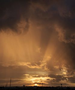 Low angle view of cloudy sky at sunset