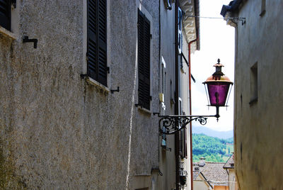 Pink street lamp in compiano, parma, emilia romagna, italy.