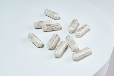 Close-up of pills on white background