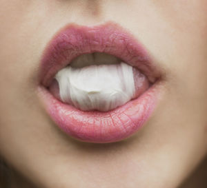 Close-up of woman with pink eye