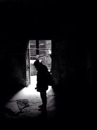Full length of woman standing in building