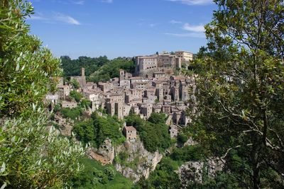 Panoramic view of historic building of sorano in tuscany against sky