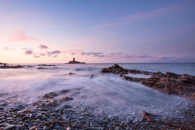 Scenic view of sea against sky during sunset