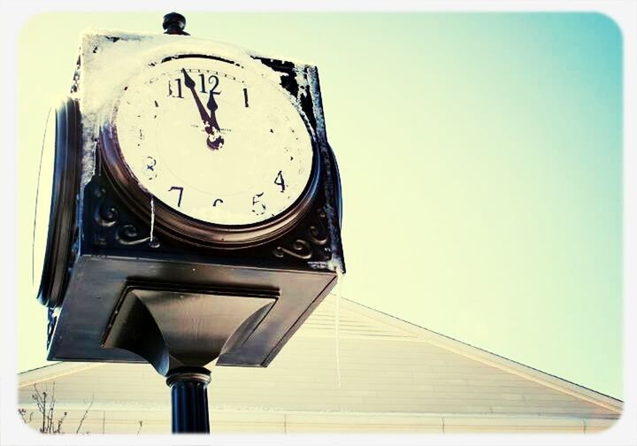 low angle view, clear sky, clock, time, architecture, built structure, building exterior, tower, communication, clock tower, transfer print, auto post production filter, copy space, close-up, text, day, clock face, no people, old-fashioned, outdoors