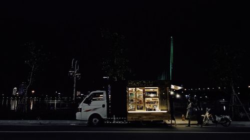 Cars on street in city at night