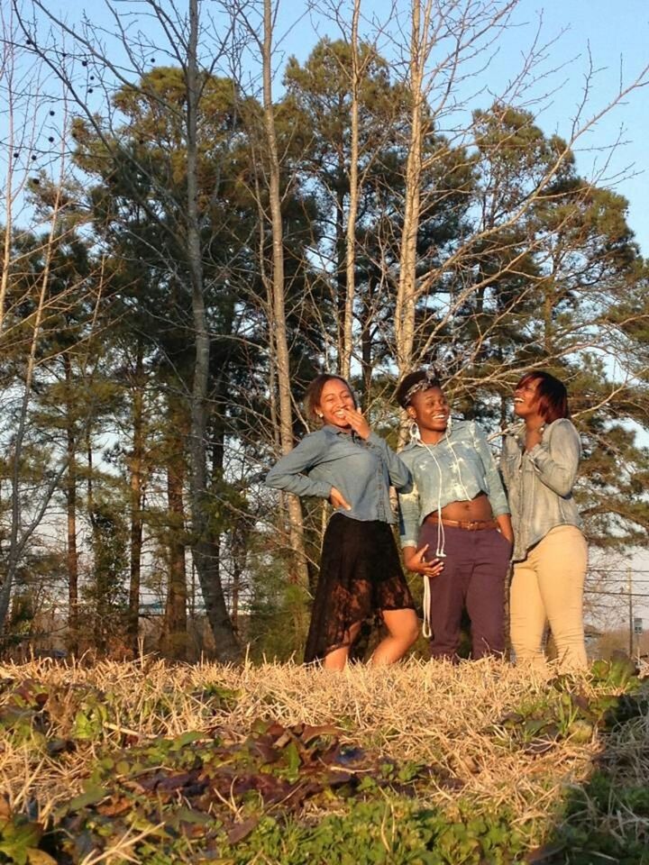 tree, lifestyles, leisure activity, standing, full length, casual clothing, tree trunk, person, rear view, nature, grass, day, three quarter length, growth, tranquility, sitting, outdoors, men