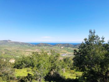 Scenic view of landscape against clear blue sky