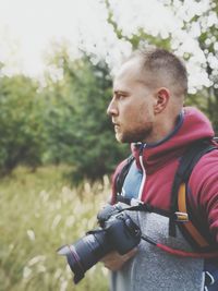 Man with camera on field