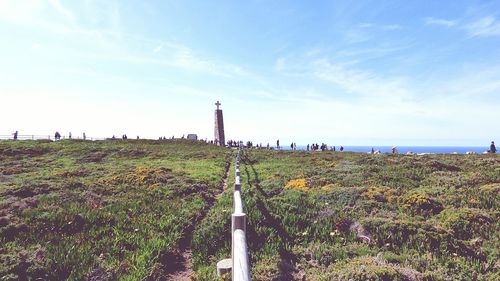 Lighthouse against cloudy sky