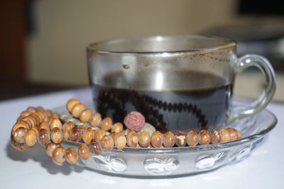 Close-up of coffee served on table