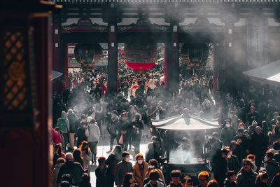 People at illuminated temple