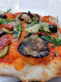 Close-up of pizza served in plate