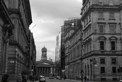 City street amidst buildings against sky