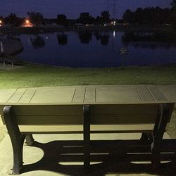 Shadow of chair on water at night