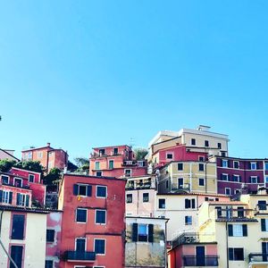 Low angle view of buildings against blue sky