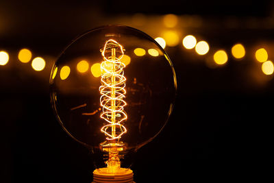 Close-up of illuminated light bulb