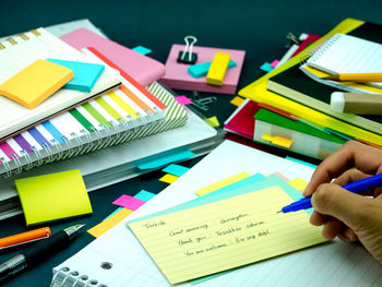 Low section of person working on book