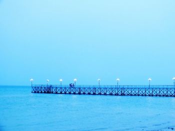 Scenic view of sea against clear blue sky