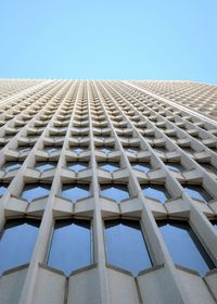 Low angle view of building against clear blue sky