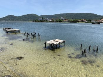 High angle view of wooden posts in lagoa lake against sky in florianapolis 