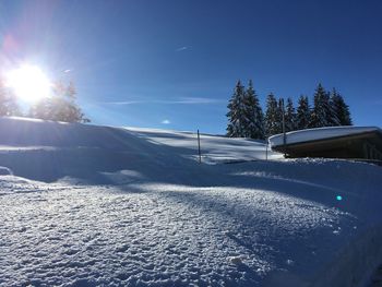 Scenic view of frozen landscape against sky