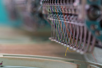 Close-up of colorful threads in sewing machine