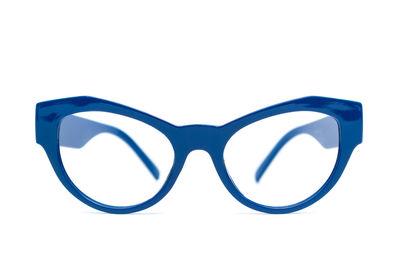 Close-up of eyeglasses against white background